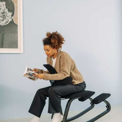 woman sitting reverse cowgirl on thatsit chair